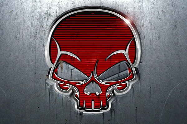 A red skull with a metal frame on a gray background