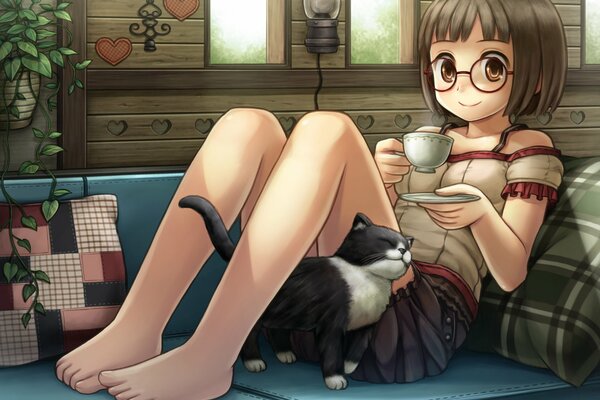 Niña y gato con taza de té