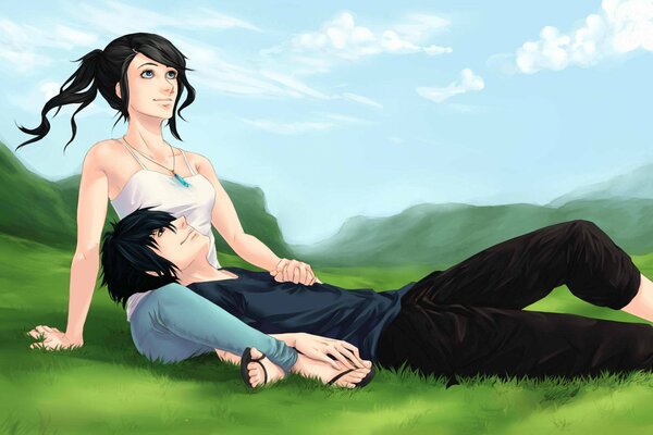 Chica con chico relajarse en la hierba