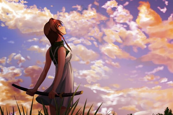 A girl with a sword looks at the sky in yellow clouds