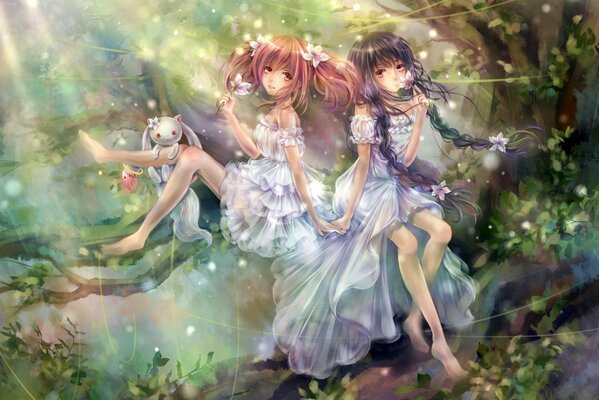 Girls in transparent clothes with flowers in their hair among trees and greenery