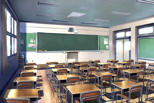 An empty school classroom with desks and a blackboard