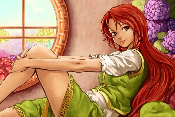 A red-haired girl in a dress is sitting by the window