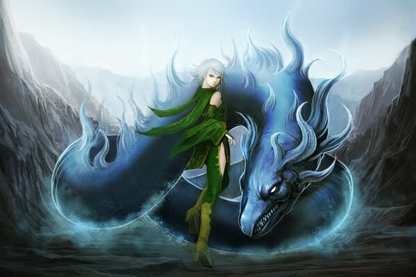 The girl stands near the dragon among the rocks