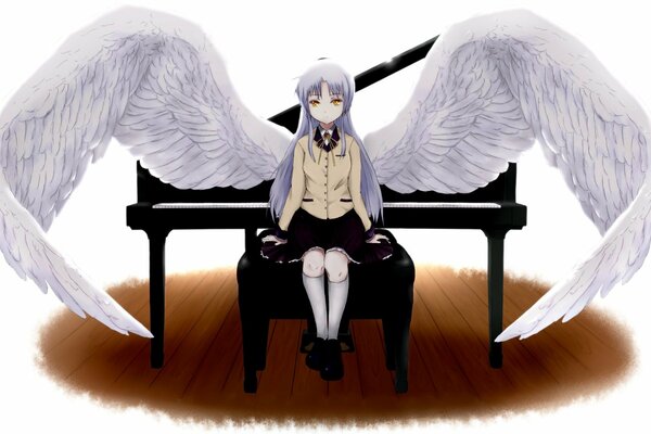 A girl at the piano with angel wings