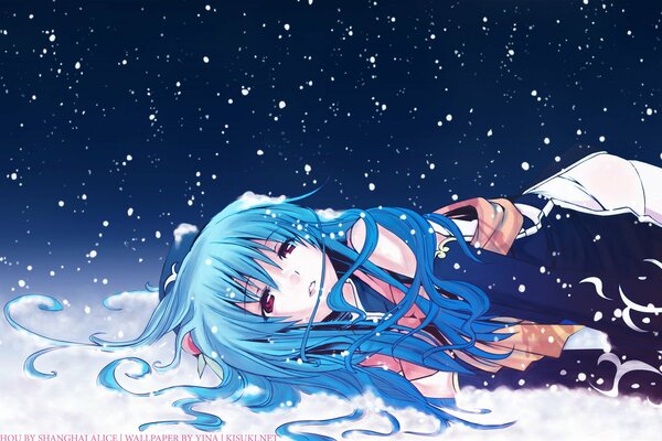 A girl in the snow enjoys the starry sky