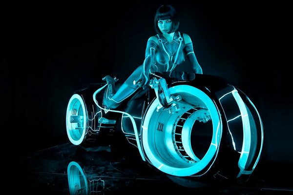 A girl on a fancy motorbike with a backlight