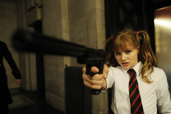 Chloe Moritz with a gun about to kill