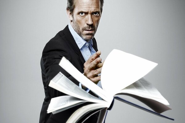 Dr. House exploring a new book