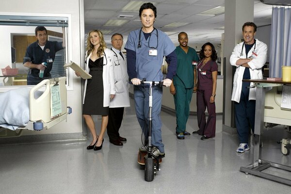 Characters from the TV series Clinic. John Dorian on a scooter.