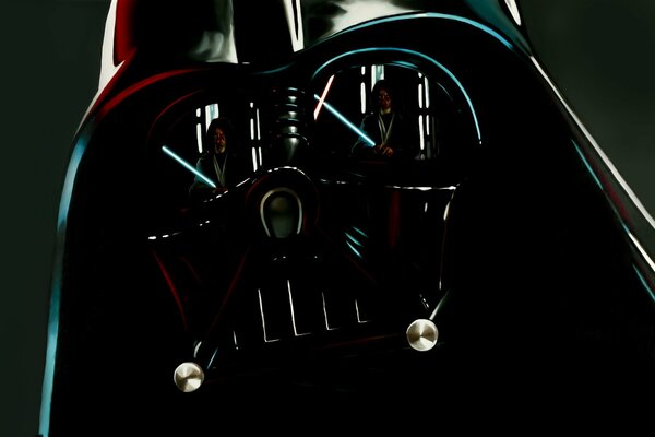 A Jedi with a sword is reflected in Darth Vader s helmet