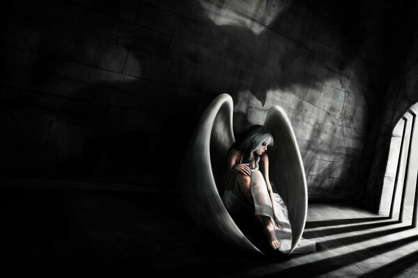 Девушка с крыльями пленница в тюрьме на черно-белом фоне