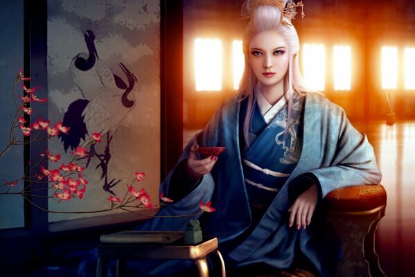 A girl drinks tea in a kimono