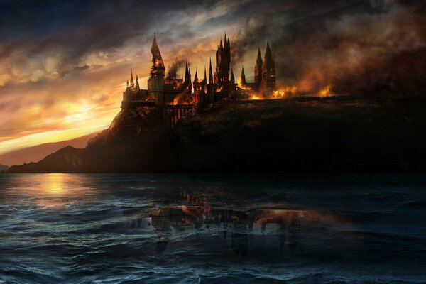 Castle on fire on the background of the sea