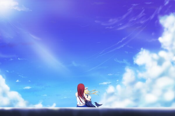 Deux filles et un ciel bleu avec le soleil