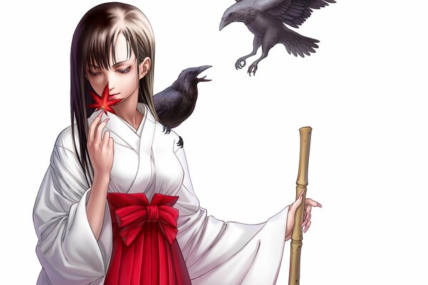 Chica japonesa con una hoja y un Cuervo en el hombro