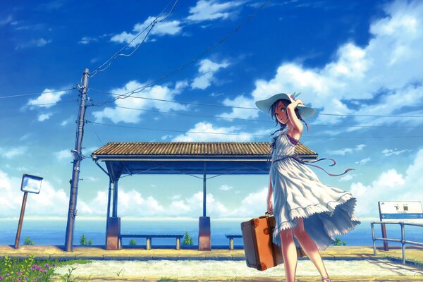 A girl in a hat with a suitcase in the wind