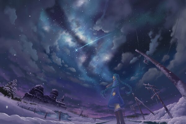 The girl looks at the starry sky