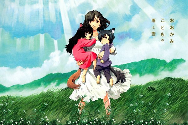 A girl with a boy and a girl in her arms on a green field under the clouds