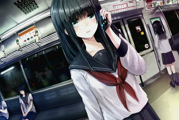 Japanese schoolgirl in the subway with a phone