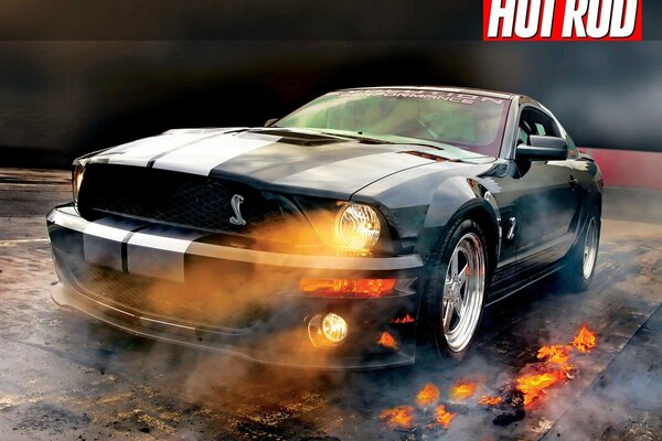 Mustang shelby gt500, shining with fiery headlights. Smoke