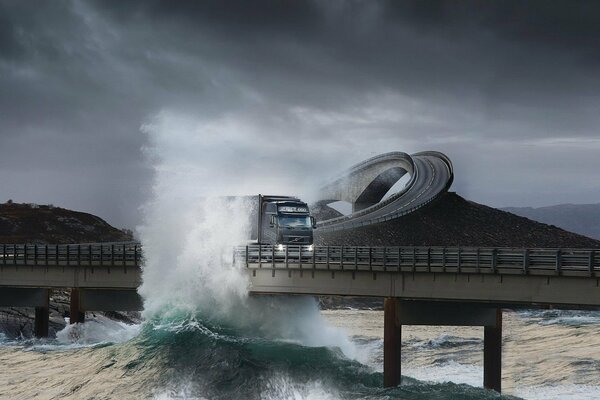 Beautiful photo of a truck on an overpass with waves