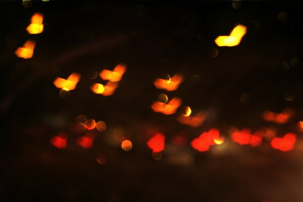 Lights in the form of hearts on a dark background