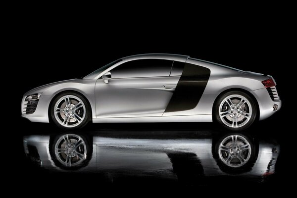 Silver Audi side view with reflection