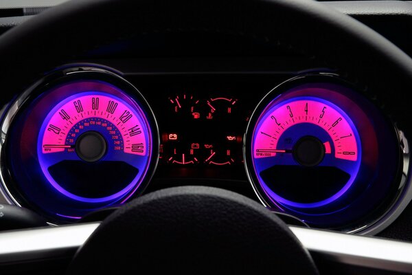 An image of the dashboard and steering wheel from the mustang