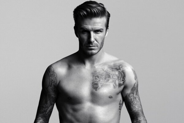 Football player David Beckham with a bare torso