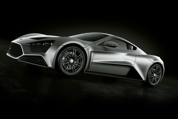 Silver sports car on a black background