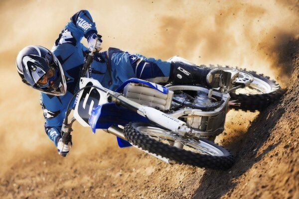 Motocross rider on a motorcycle on the track