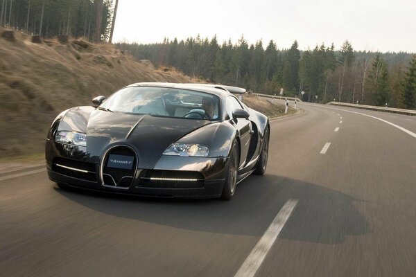 Bugatt Mansory Veyron black on the track front view