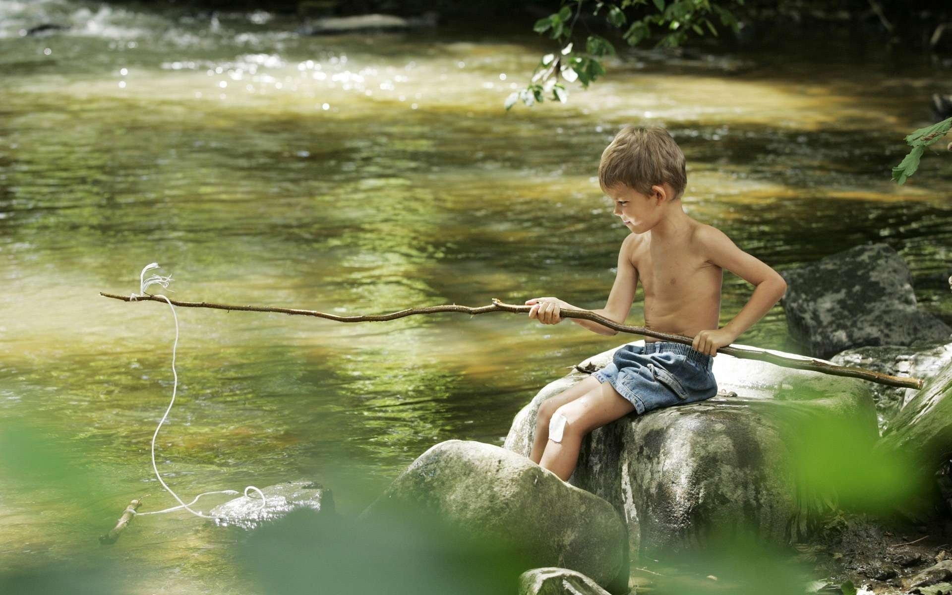 boy child river fishing