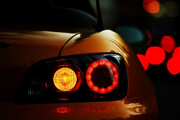 Car headlight in evening lights