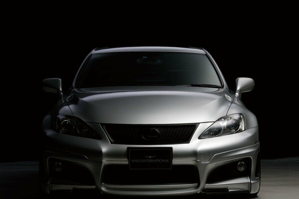 Silver lexus on a black background