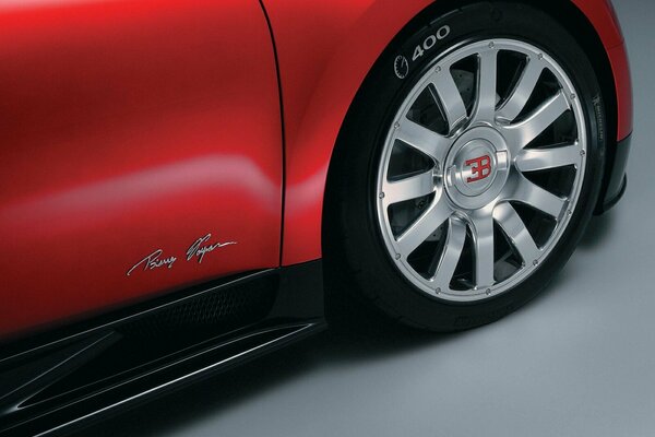 The side of the red bugatti, beautiful lines