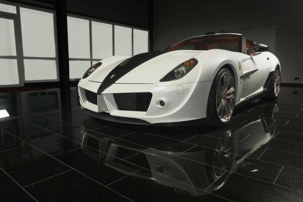 Brand new white Ferrari, reflected on the floor