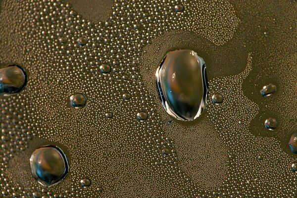 Large drops of water on metal