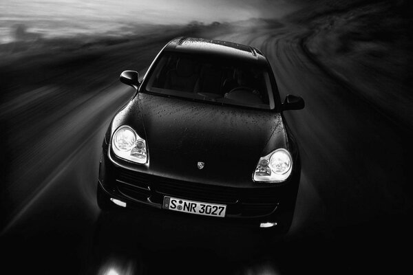 Black and white image of a car in motion