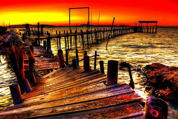 Abandoned sea pier at sunset