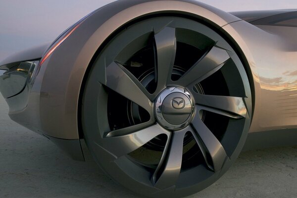 Futuristic mazda with big wheels in the desert