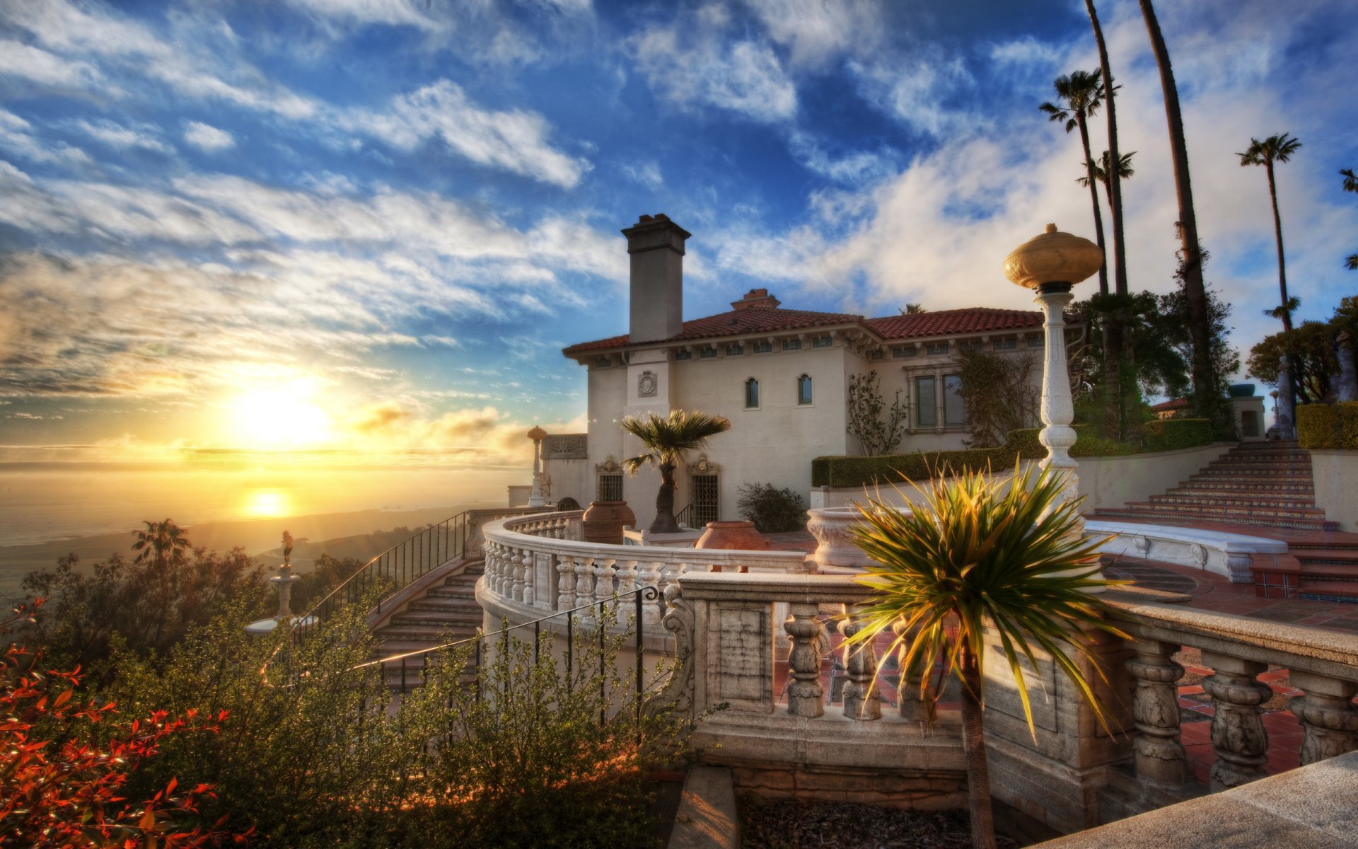 puesta de sol castillo de hearst casa océano nubes