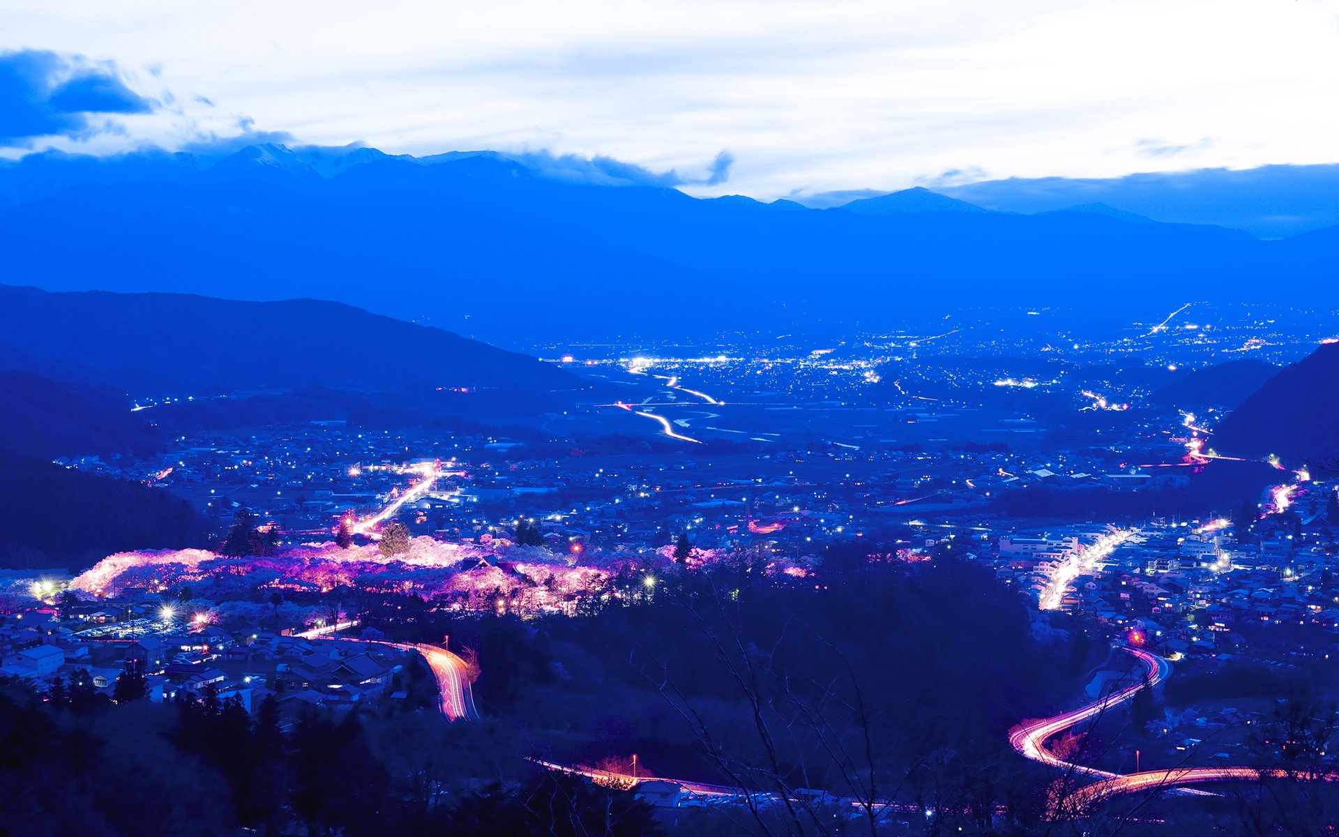 road night lights clouds mountain