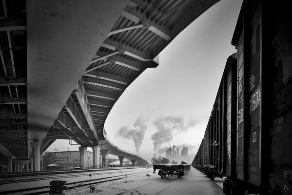 Winter railway under the bridge