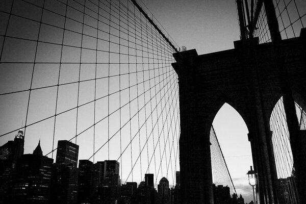 The bridge is a black and white arch with a grid