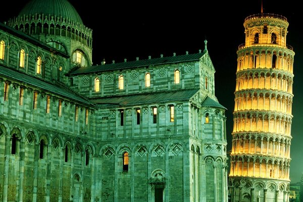 Amazing night illumination of the Leaning Tower of Pisa and other attractions