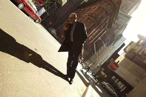 Creative photo of a man with glasses and coffee