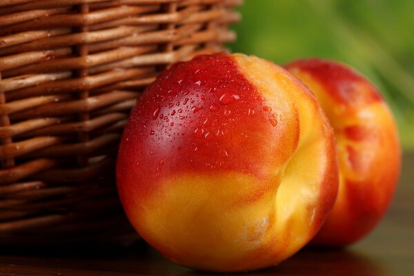 Peaches from a basket on a beautiful background