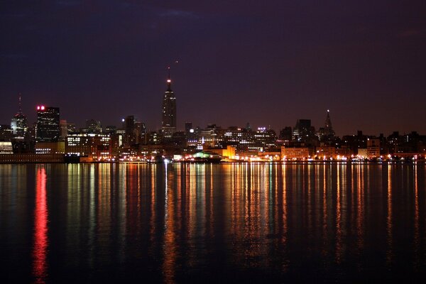 Reflection of the lights of a big city in the sea